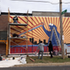 Hawkins and his team working on the mural. He said he had to bring on three folks to help out because it was such a big project.